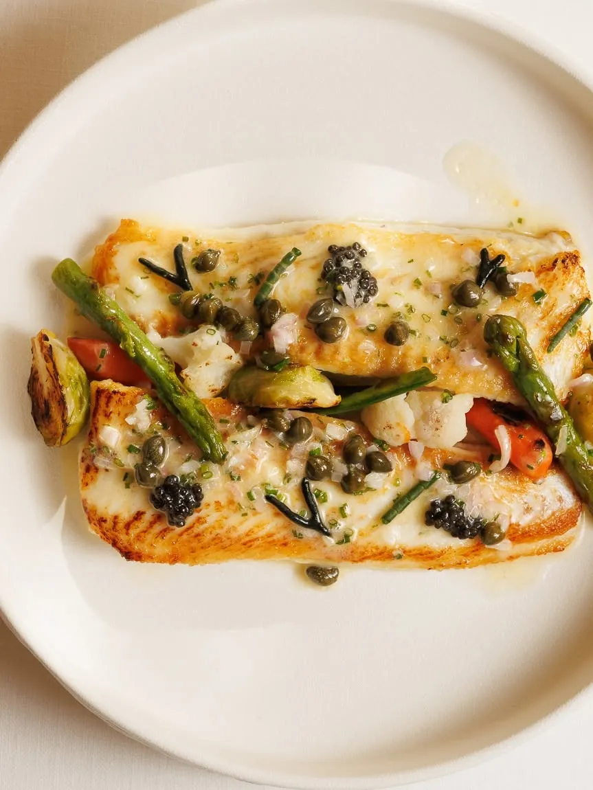 Wild fish with capers and green asparagus
