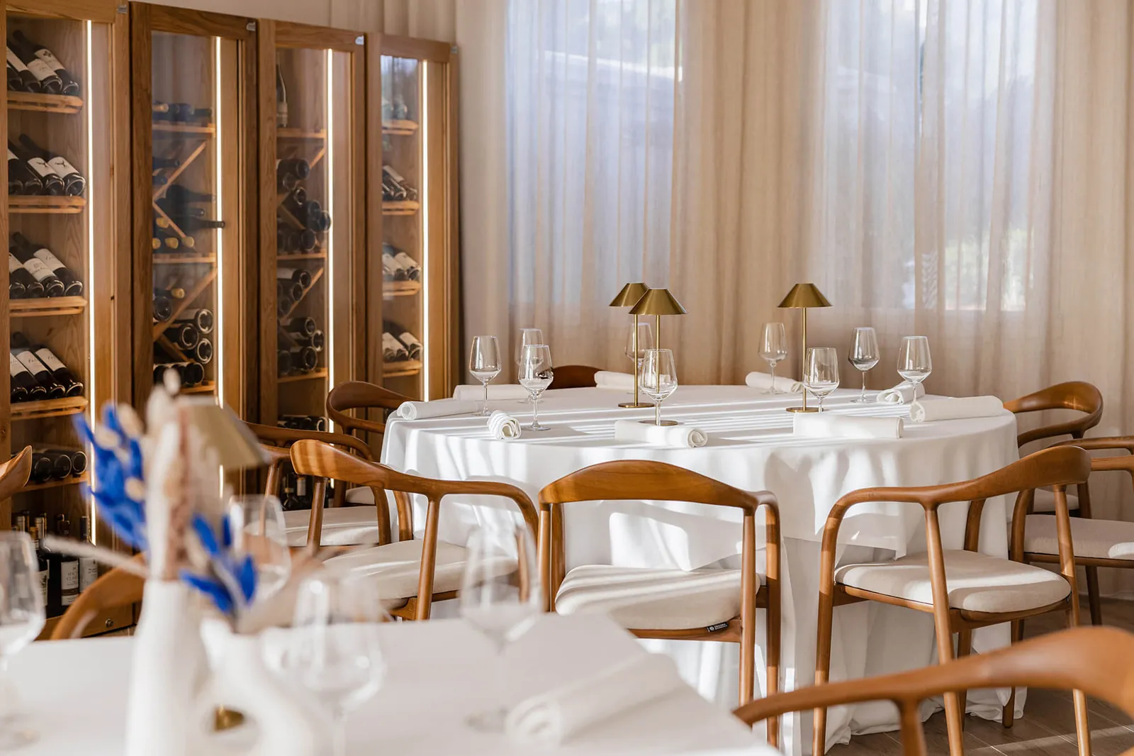 The dining room with the glass wine cellar